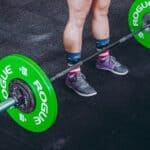 preparing to lift a barbell at the gym